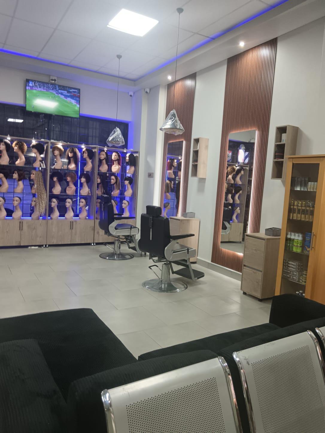 Just Beauty salon interior with chandeliers and styling chairs